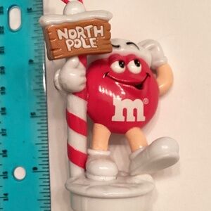 1999… Collectible RED M&M Candy Tube Top Ornament… with North Pole Sign!